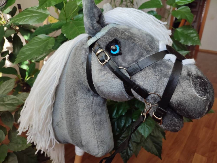 Gray realistic Hobby horse with mexican bridle on a stick for kids 
