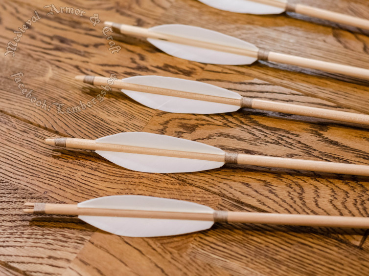 White wooden arrows for traditional and medieval archery. Linden